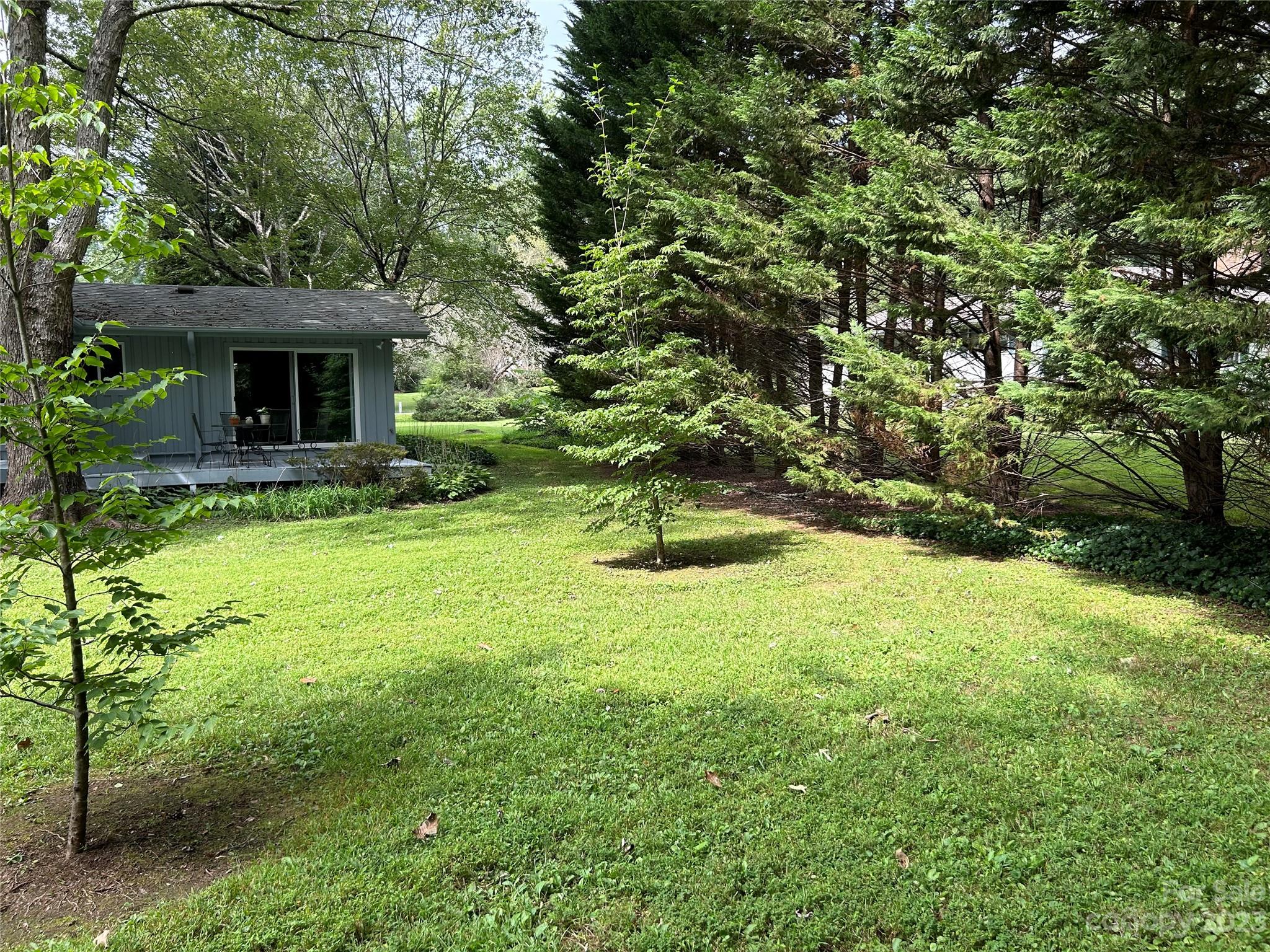 428 Brandon Road Hendersonville, NC 28739 - Photo 43 of 48 a view of an house with backyard space and garden