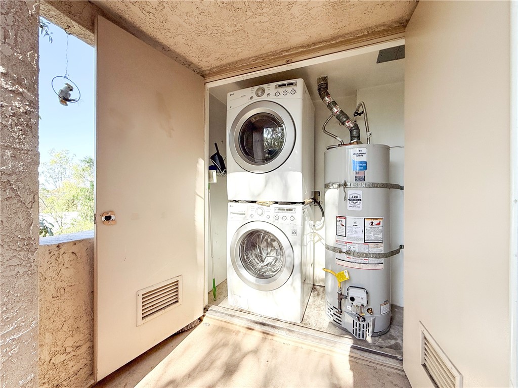 26342 Forest Ridge Drive, Unit 4H Lake Forest, CA 92630 - Photo 25 of 38 Current condition washer and dryer in closet on balcony