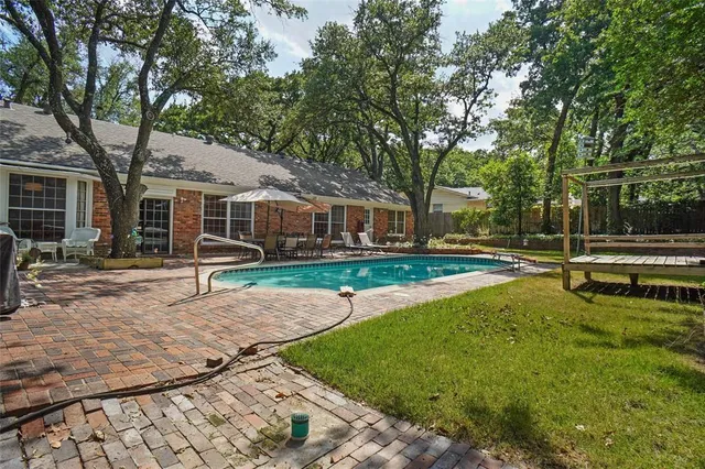 a view of a house with a yard porch and sitting area