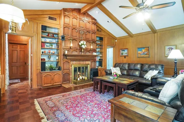 a living room with lots of furniture and a rug