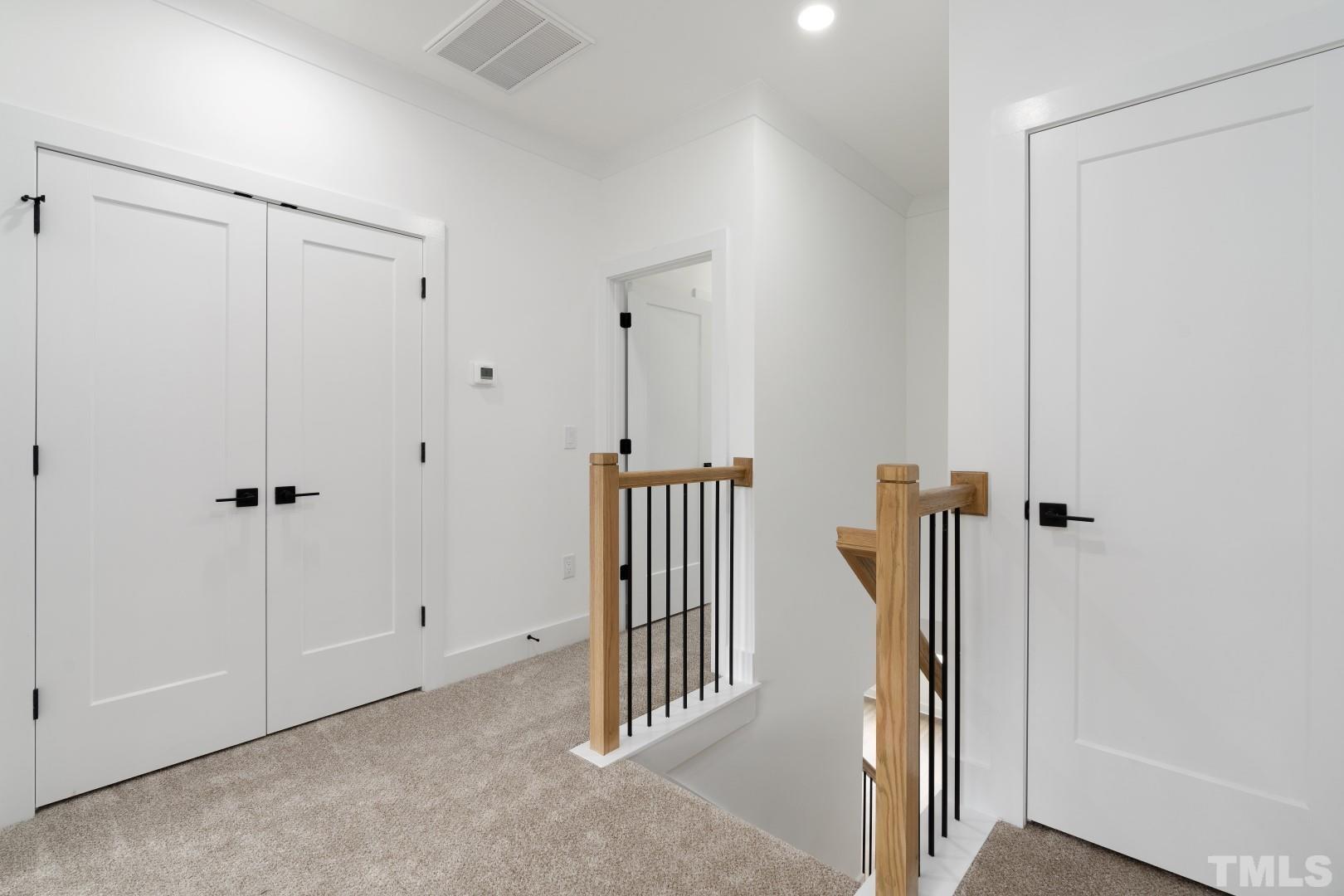 6108 Fox Road Raleigh, NC 27616 - Photo 16 of 40 a view of a hallway with entryway door