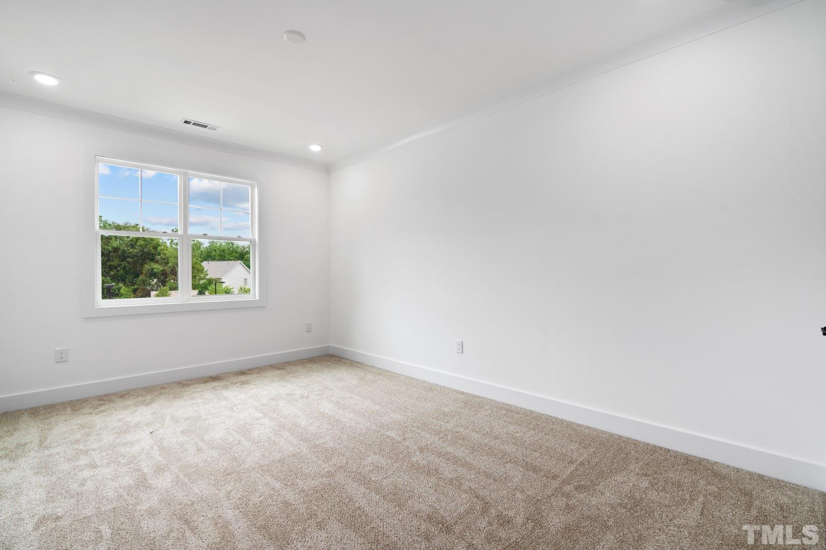 6108 Fox Road Raleigh, NC 27616 - Photo 18 of 40 an empty room with windows