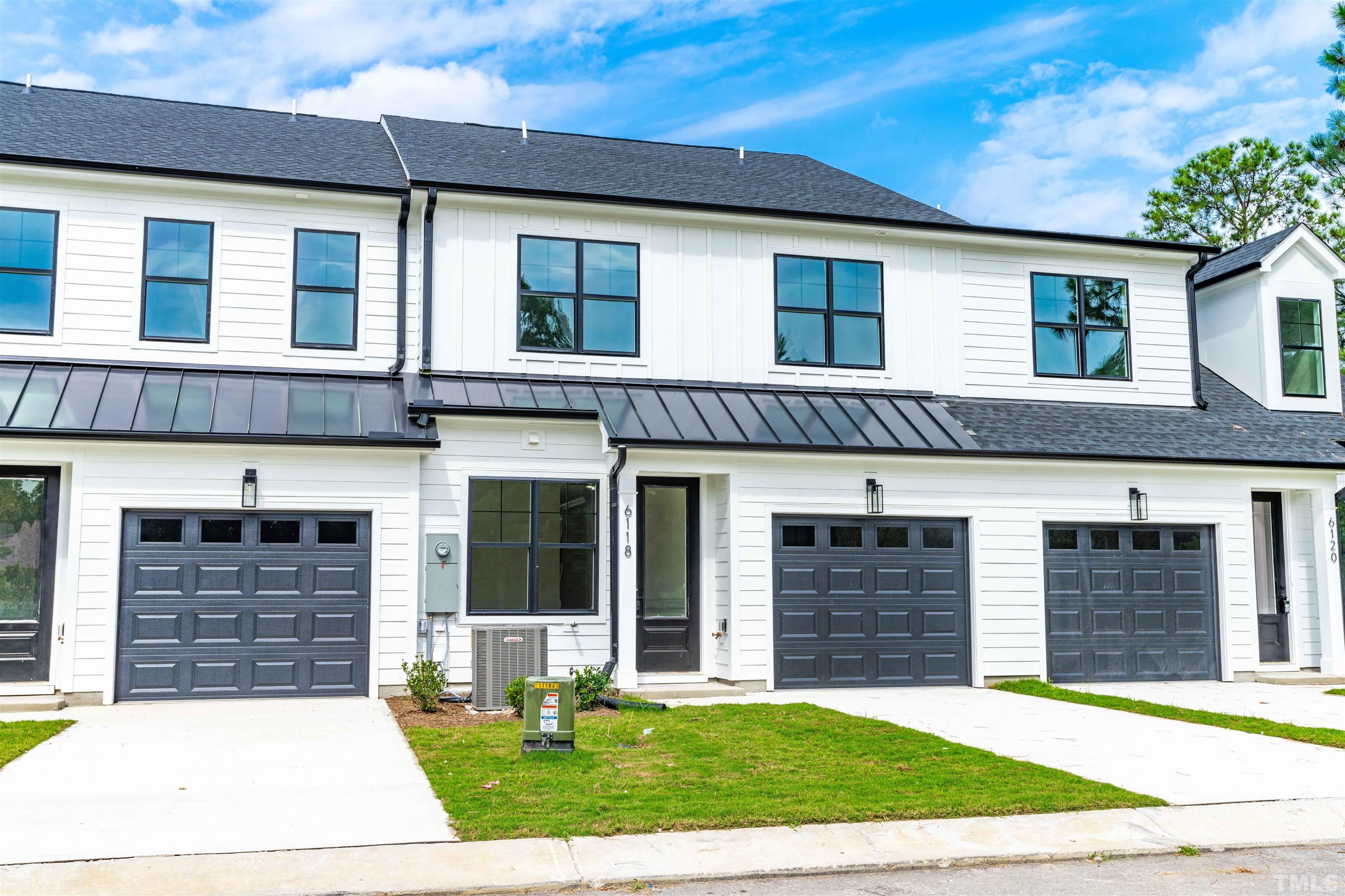 6108 Fox Road Raleigh, NC 27616 - Photo 2 of 40 a front view of a house with a yard and garage