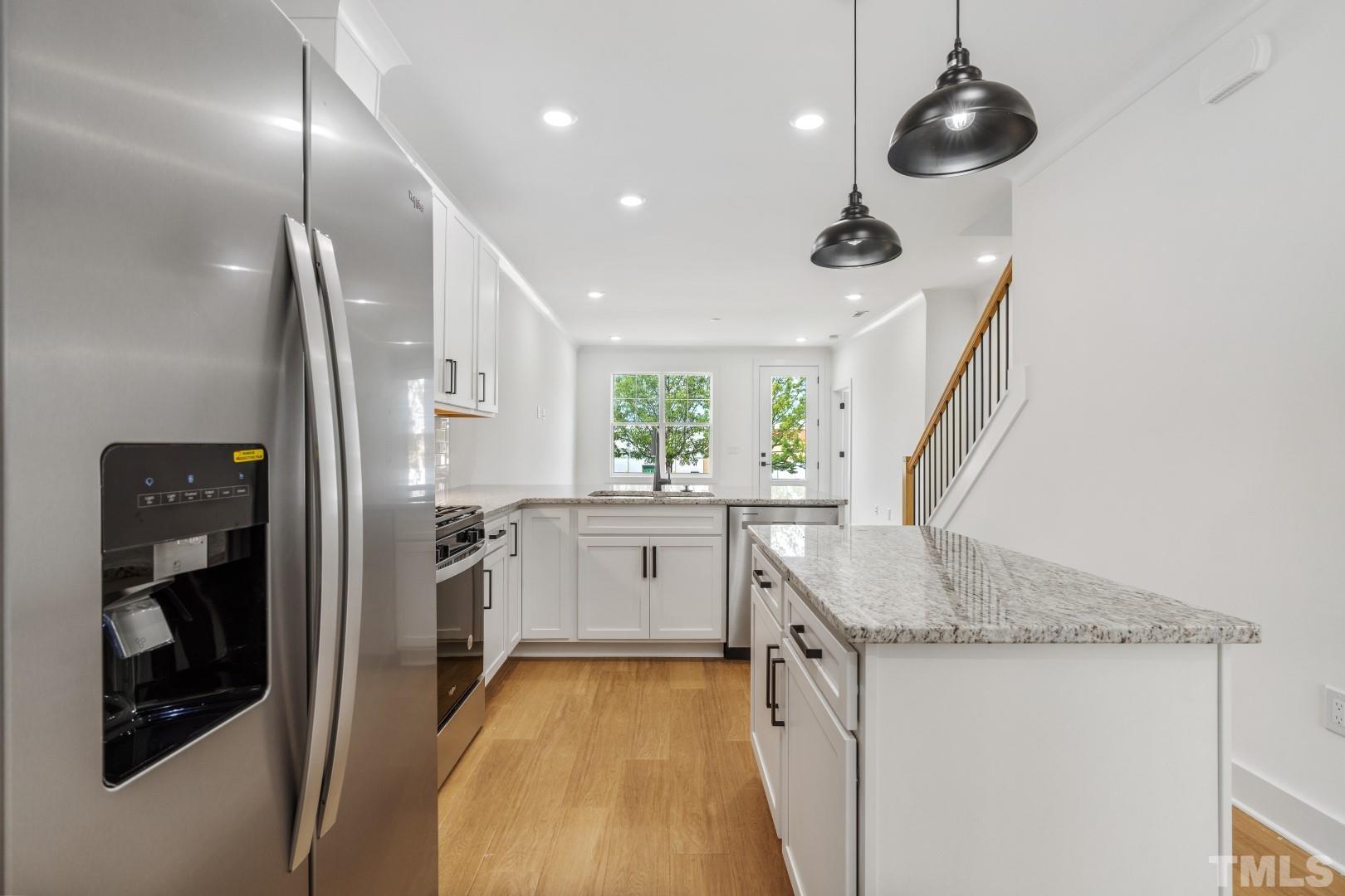 6108 Fox Road Raleigh, NC 27616 - Photo 28 of 40 a kitchen with a sink appliances and cabinets