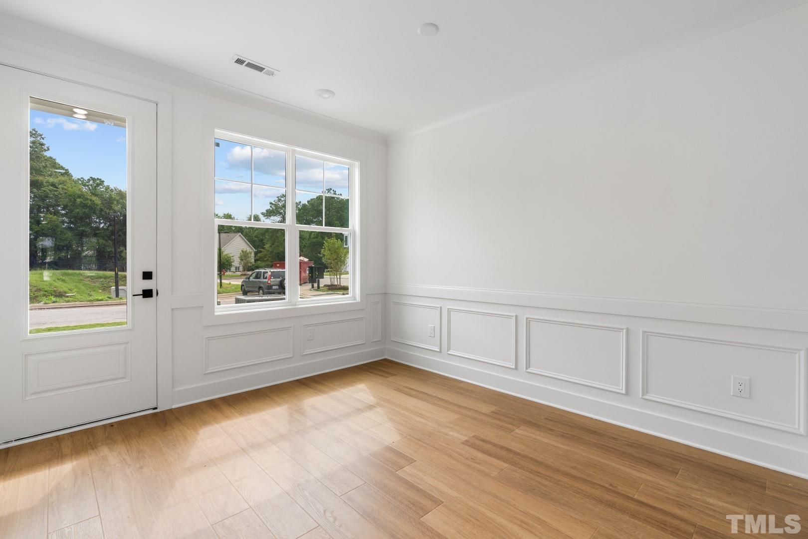 6108 Fox Road Raleigh, NC 27616 - Photo 35 of 40 wooden floor in an empty room with a window