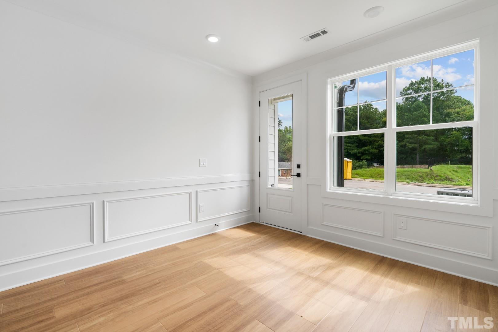 6108 Fox Road Raleigh, NC 27616 - Photo 38 of 40 wooden floor in an empty room with a window