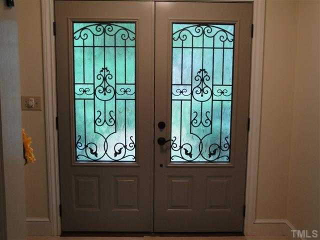 10209 Whitestone Road Raleigh, NC 27615 - Photo 3 of 25 New energy efficient doors in foyer. Installed May 2010.