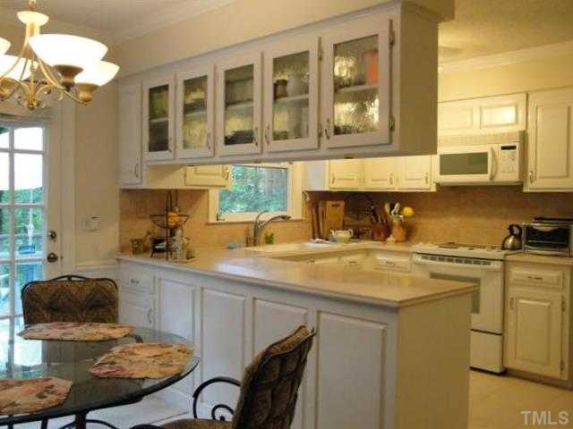 10209 Whitestone Road Raleigh, NC 27615 - Photo 4 of 25 Freshly painted kitchen and breakfast area.