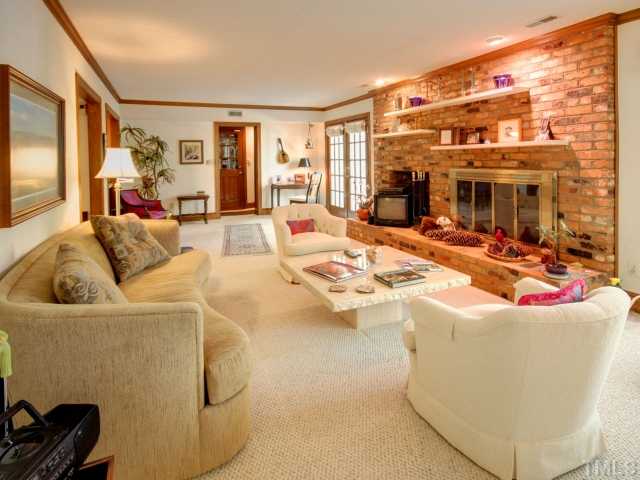 10209 Whitestone Road Raleigh, NC 27615 - Photo 6 of 25 Large family room with masonite fireplace