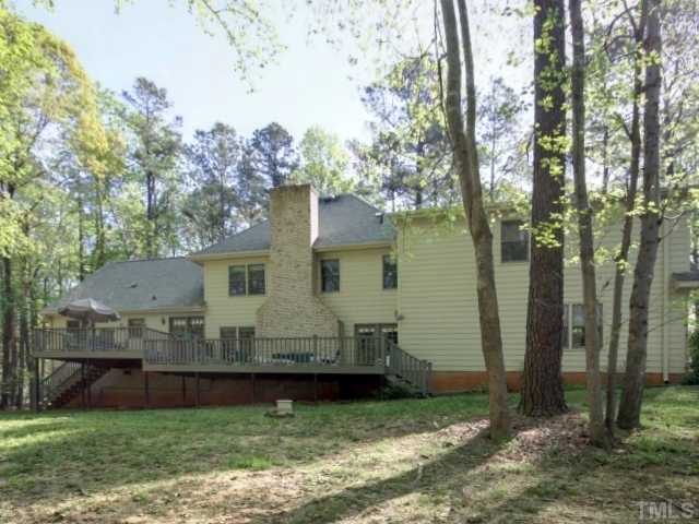 10209 Whitestone Road Raleigh, NC 27615 - Photo 10 of 25 Large fireplace and multiple windows