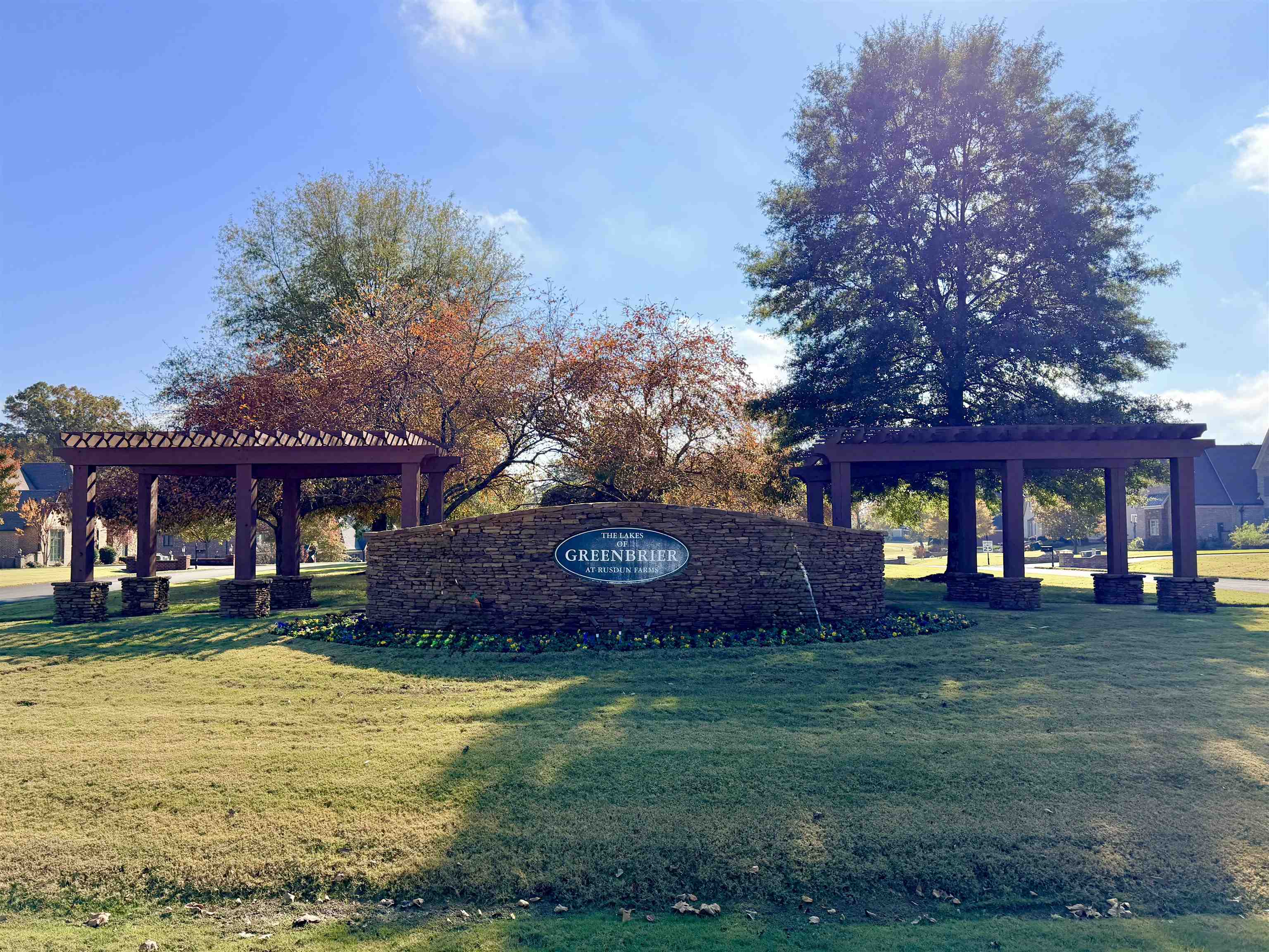 a front view of a building with a yard