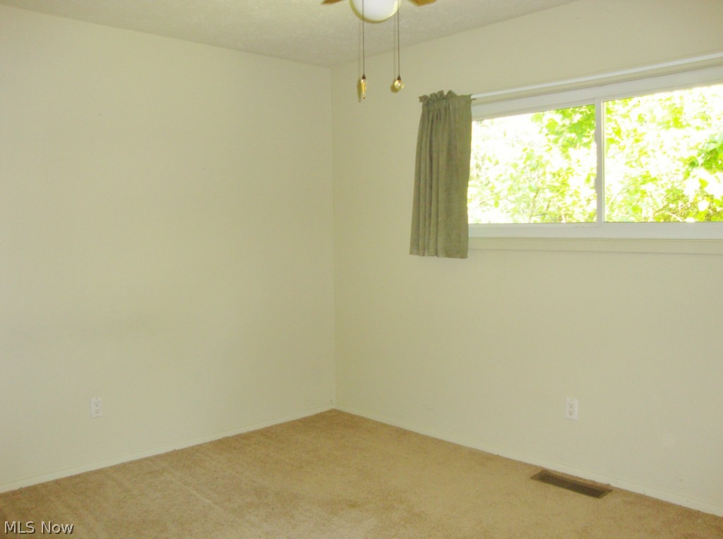 5698 Rock Point Circle North Ridgeville, OH 44039 - Photo 14 of 25 Bedroom 3 offers neutral carpet and walls.