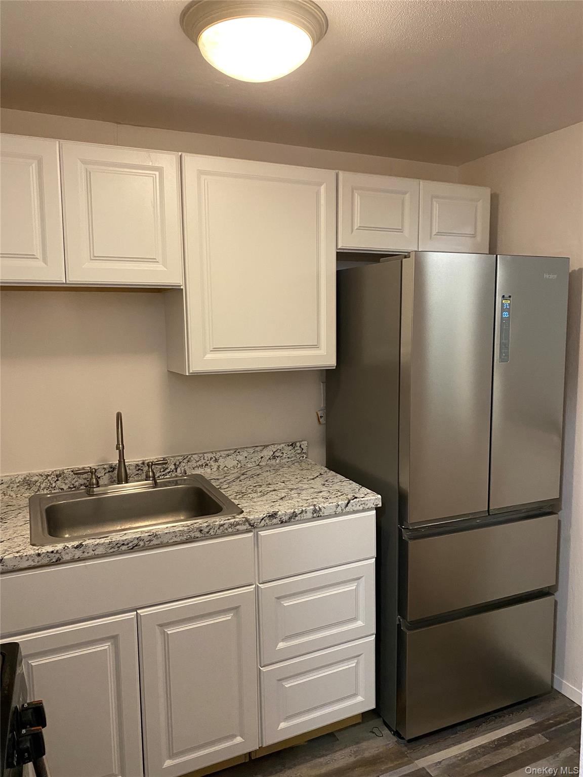 84-24 98th Street, Unit 1 Queens, NY 11421 - Photo 6 of 22 a kitchen with appliances and cabinets