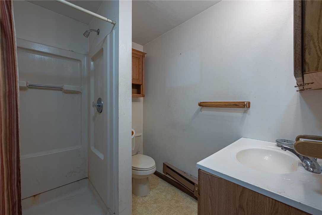 6885 Garber Road Clayton, OH 45415 - Photo 19 of 24 This functional bathroom provides essential amenities for daily routines.