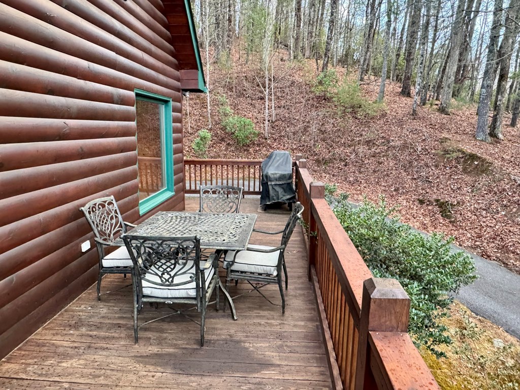 162 Toccoa Overlook Lane Blue Ridge, GA 30513 - Photo 19 of 39 a view of balcony with wooden floor and outdoor seating