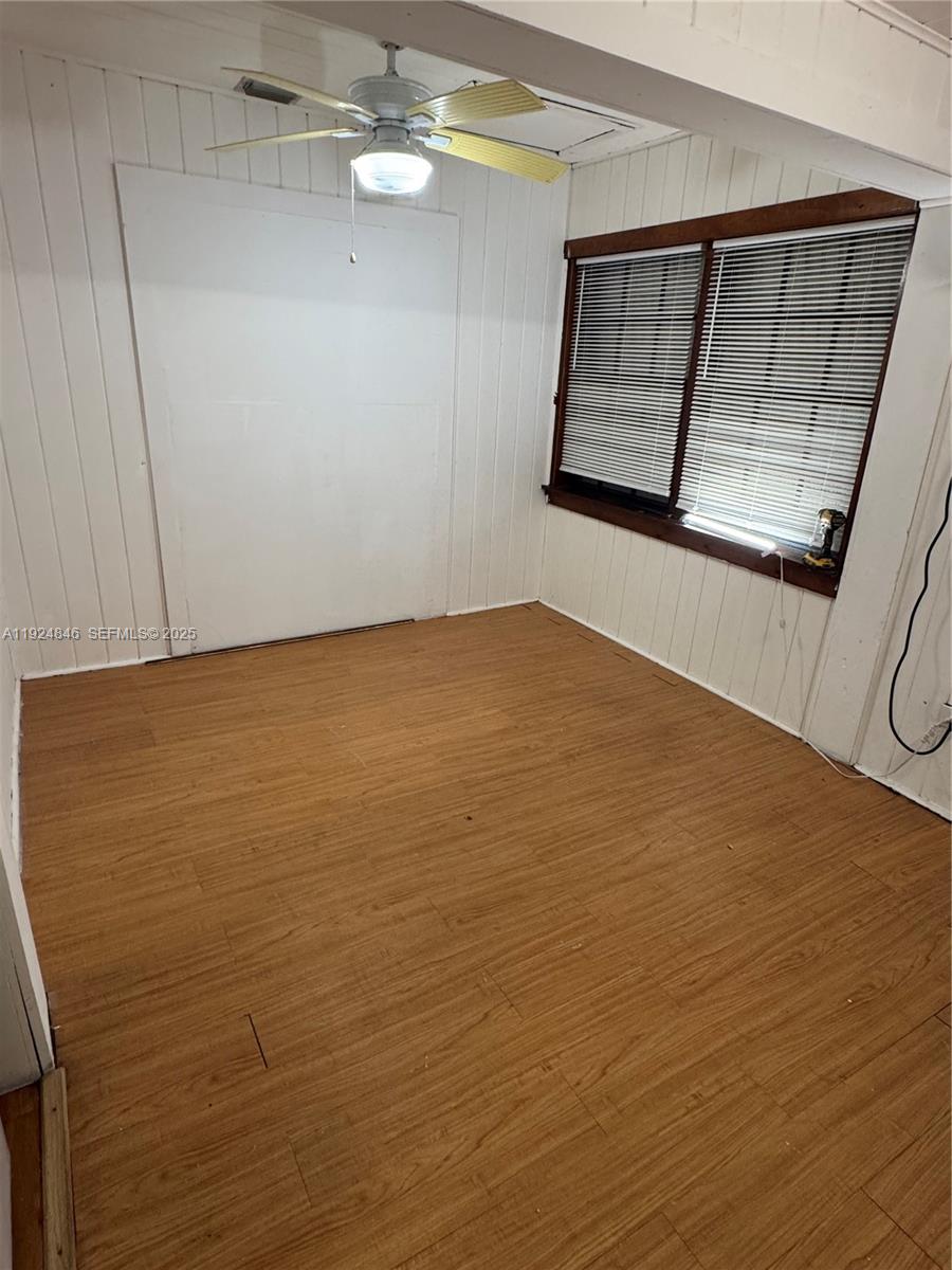 3271 (rear Studio) Nw 15th Street Miami, FL 33125 - Photo 7 of 11 a view of room with window and hardwood floor