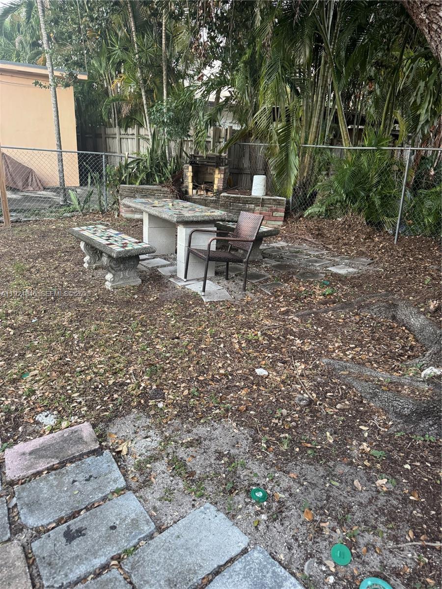 3271 (rear Studio) Nw 15th Street Miami, FL 33125 - Photo 10 of 11 a view of a bench in a backyard