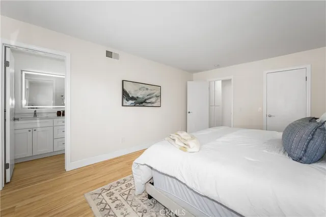 a bedroom with a bed and a table in it