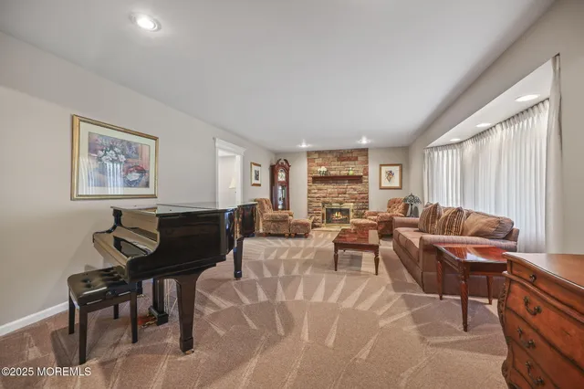 a living room with furniture a table and a window