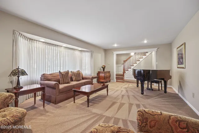 a living room with furniture and a table