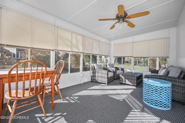 a spacious bedroom with a bed and a window