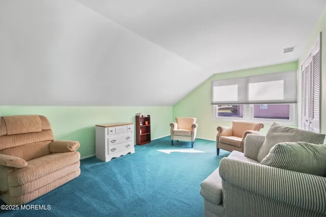 a bed room with a bed and a dresser