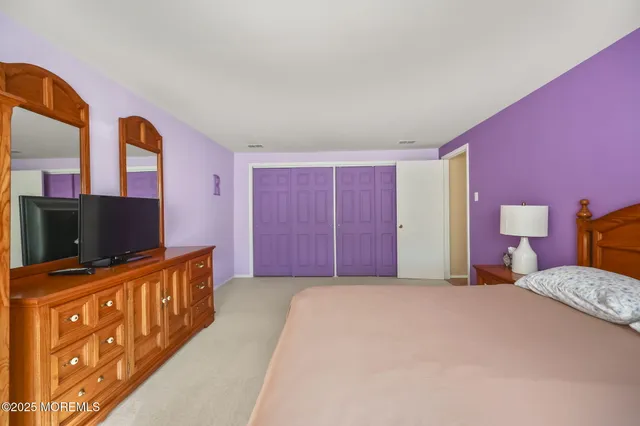 a view of swimming pool with sitting area and garden