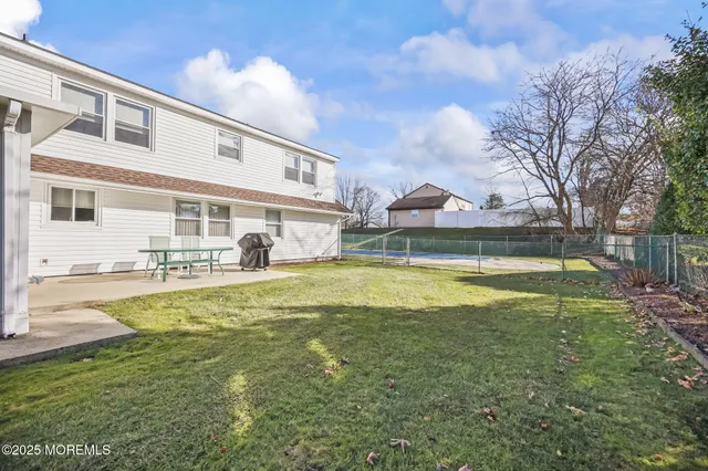 an aerial view of a house with a swimming pool