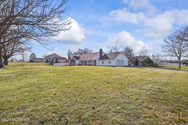 a view of a house with a big yard