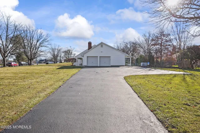 a view of a swimming pool with an outdoor space and seating area