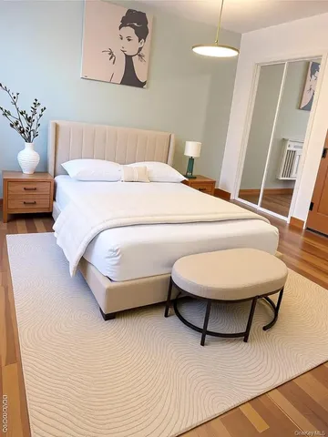 a bedroom with a bed and a dresser