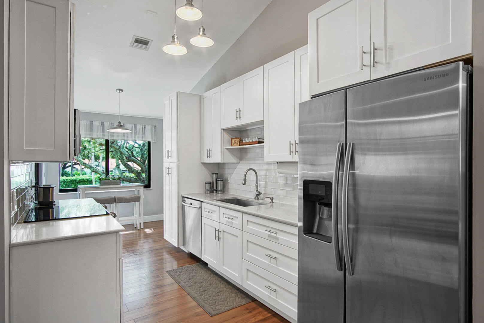 17308 Boca Club Boulevard, Unit 1102 Boca Raton, FL 33487 - Photo 2 of 48 a kitchen with stainless steel appliances a refrigerator sink and cabinets