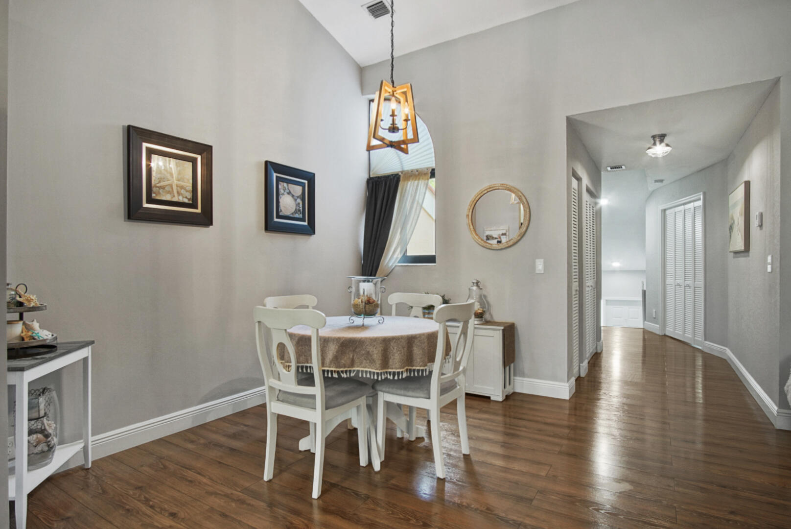 17308 Boca Club Boulevard, Unit 1102 Boca Raton, FL 33487 - Photo 7 of 48 a view of a dining room with furniture wooden floor and a chandelier