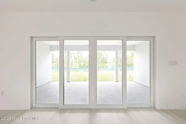 a view of an empty room and window