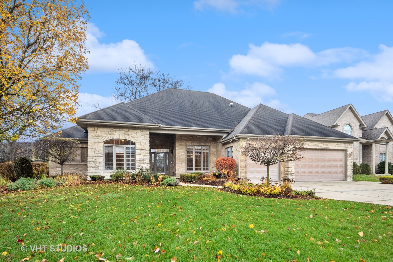 a front view of a house with a yard