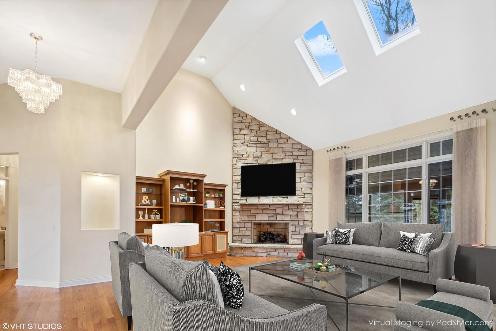 311 Pinehurst Drive Palos Heights, IL 60463 - Photo 11 of 24 a living room with fireplace furniture and a flat screen tv