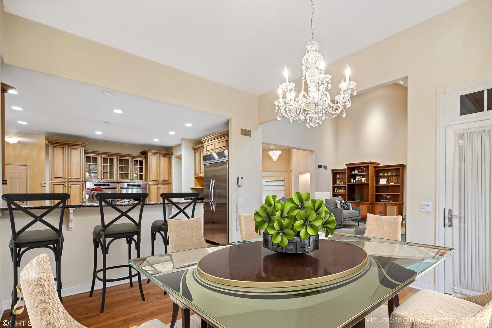 311 Pinehurst Drive Palos Heights, IL 60463 - Photo 13 of 24 a view of a dining room with furniture and chandelier