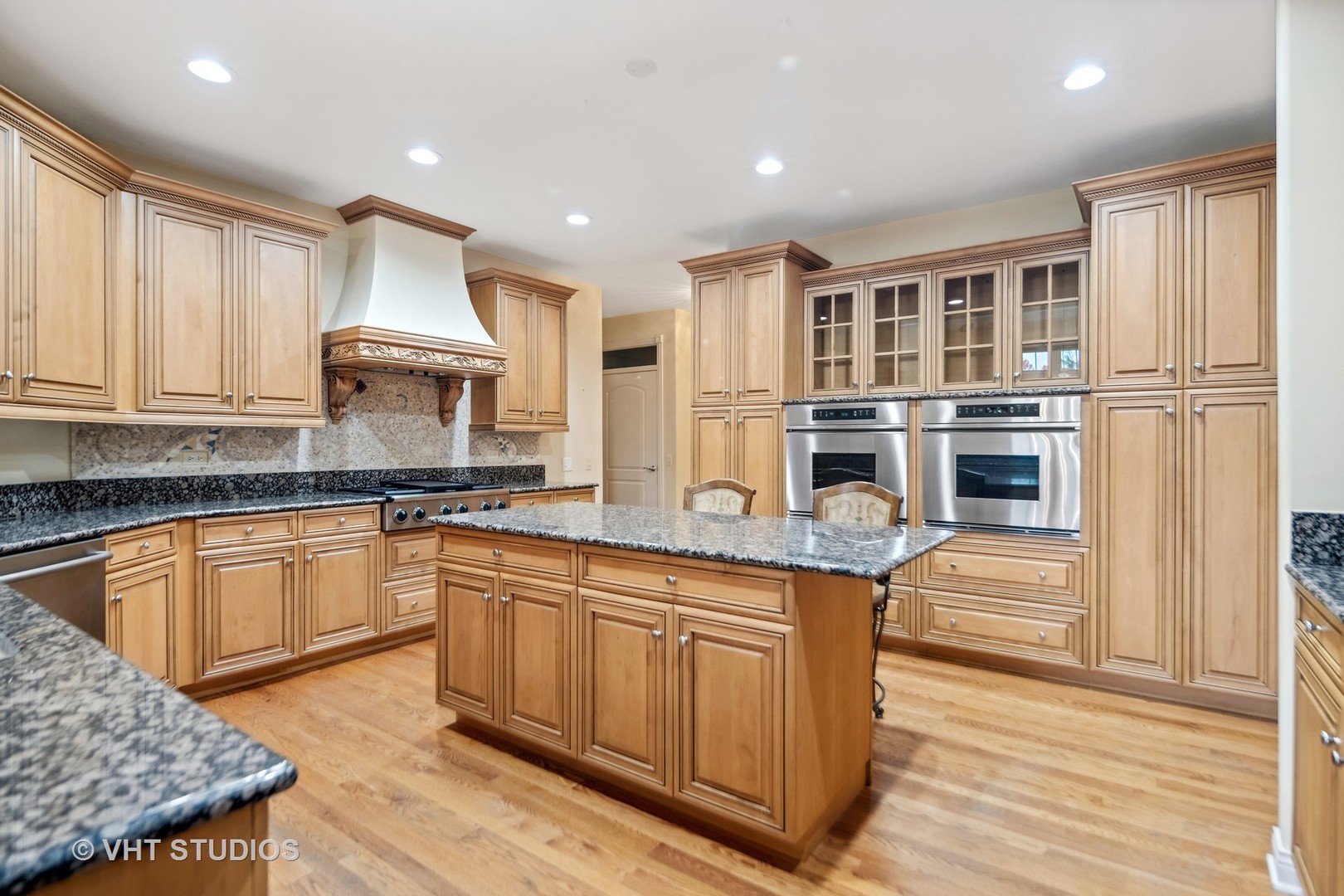 311 Pinehurst Drive Palos Heights, IL 60463 - Photo 15 of 24 a kitchen with stainless steel appliances granite countertop a stove sink and cabinets