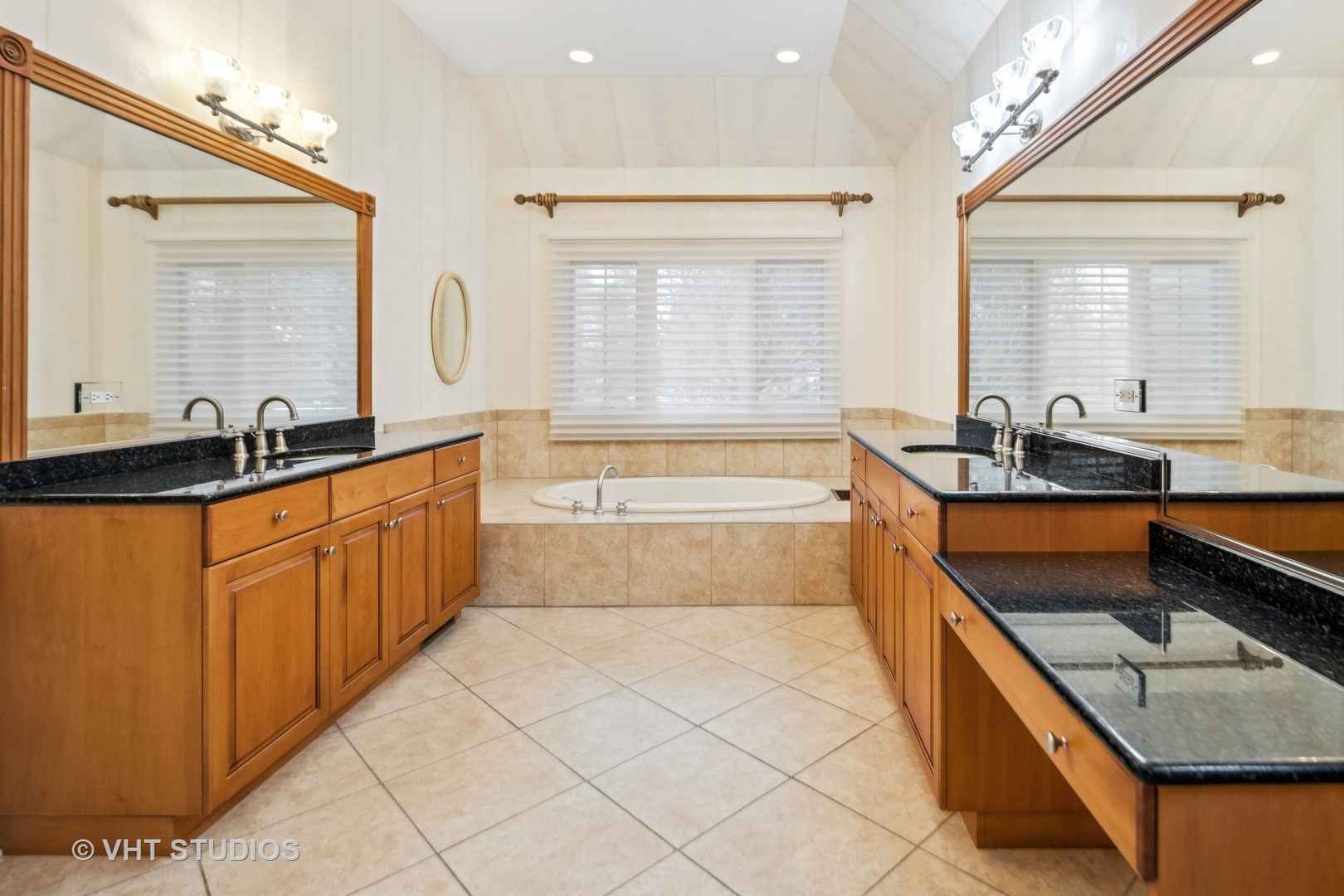 311 Pinehurst Drive Palos Heights, IL 60463 - Photo 6 of 24 a spacious bathroom with a granite countertop tub sink and mirror