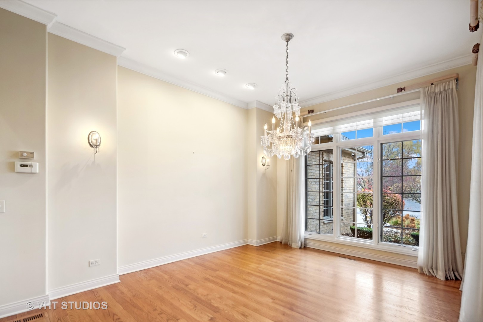 311 Pinehurst Drive Palos Heights, IL 60463 - Photo 10 of 24 a view of a room with large windows and wooden floor