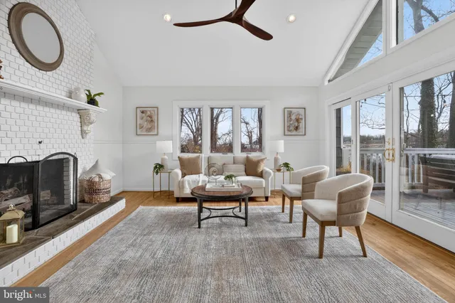 a view of a dining room with furniture wooden floor and chandelier