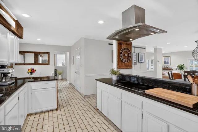 a bathroom with a double vanity sink toilet and a mirror