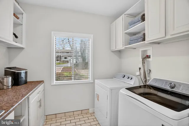 a view of a livingroom with furniture and a flat screen tv