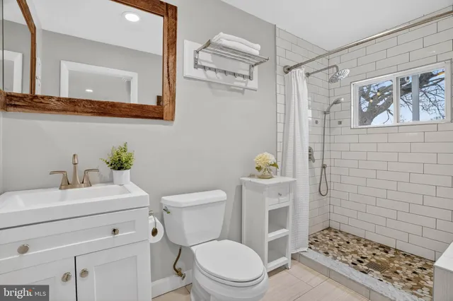 a view of a swimming pool with an outdoor space and seating area