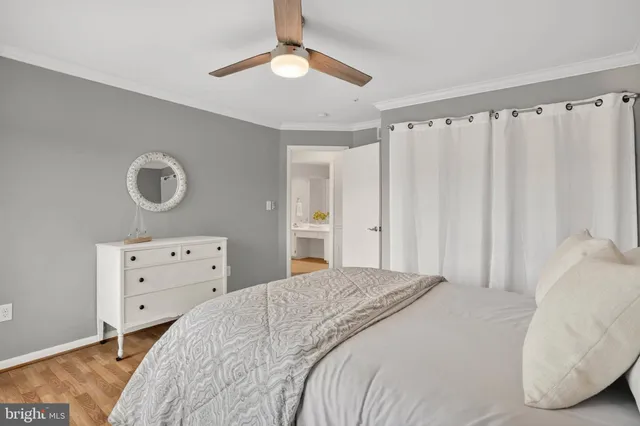 a view of a lake with boats and trees in the background