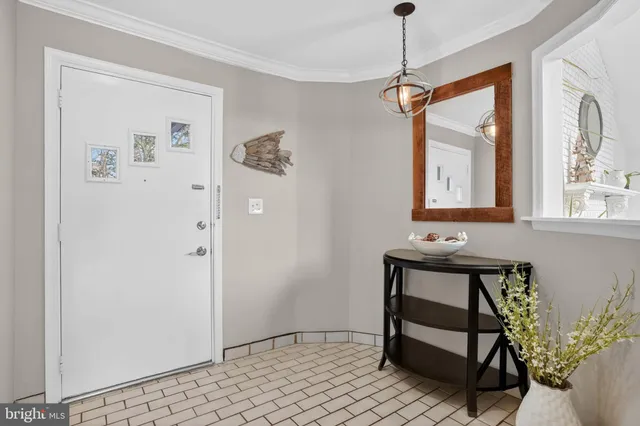 a living room with furniture a fireplace and a table