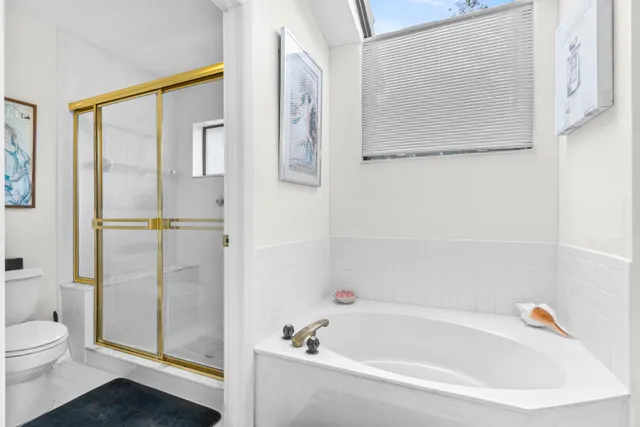 a bathroom with a bathtub and a shower