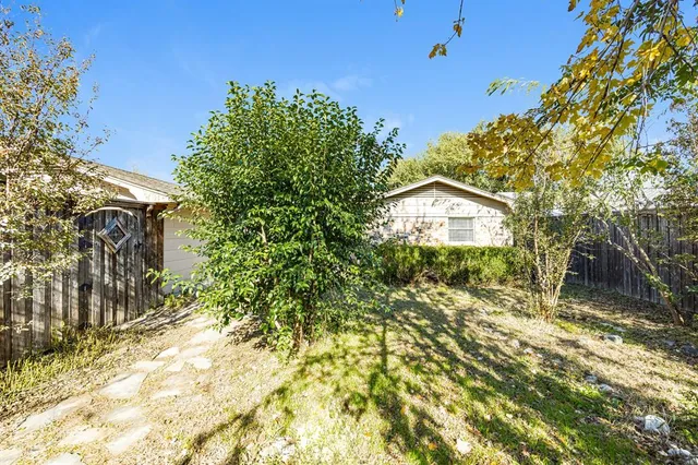 a view of a house with a tree