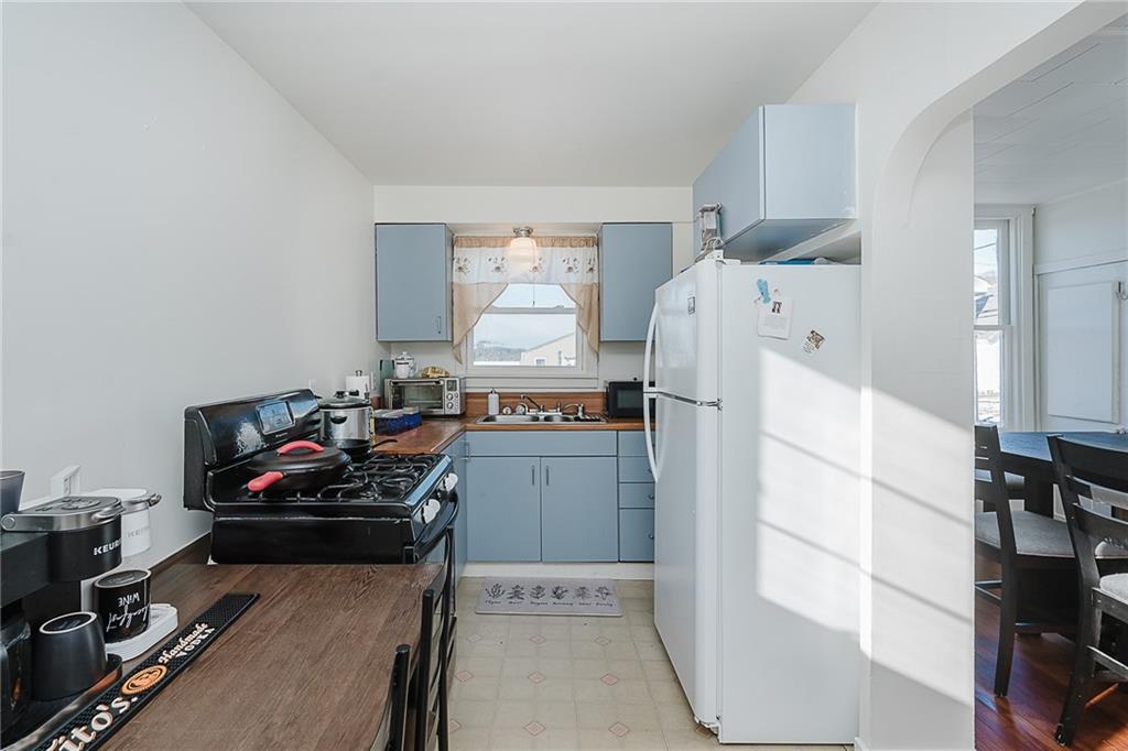 916 Main Street East Rural Valley, PA 16249 - Photo 11 of 32 a kitchen with a refrigerator and a stove