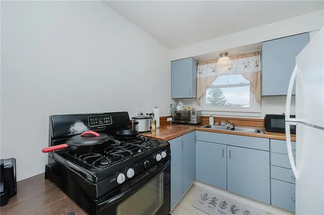 a kitchen with a stove and a sink